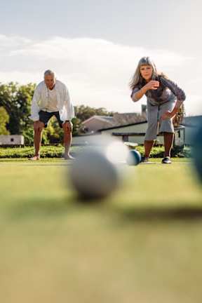 A group of people playing a game of bocce ball in a park.at The Rosalyn | Affordable 55+ Apartments in Bloomington, Minnesota
