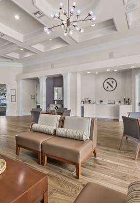 a small dining area next to a kitchen with a breakfast bar at Grandeville on Saxon, Florida