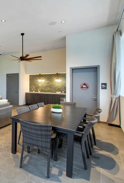 a dining room and living room with a table and chairs