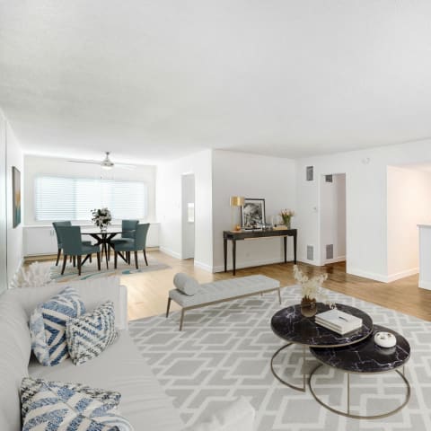 a dining room with a table and chairs and a ceiling fan