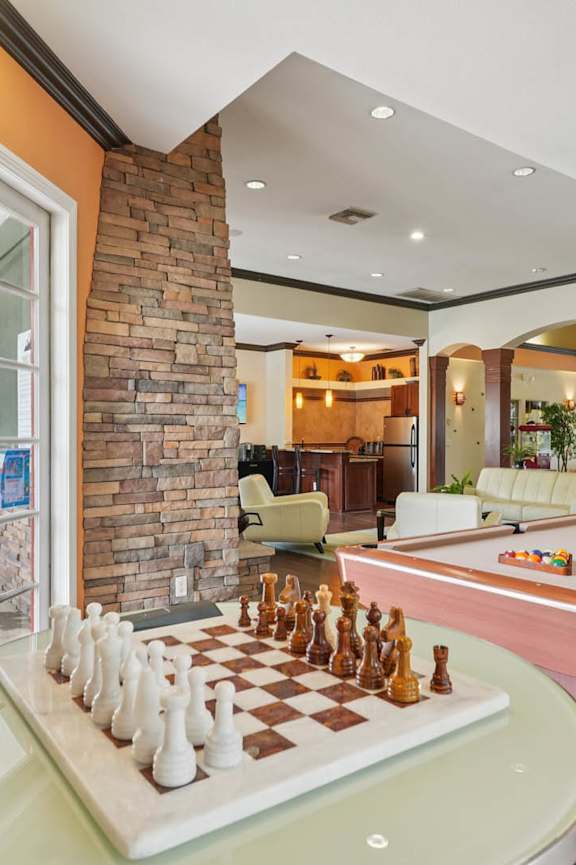 A pool table with a chess board on top of it  at Heritage at Stone Mountain, Northglenn, CO 80233