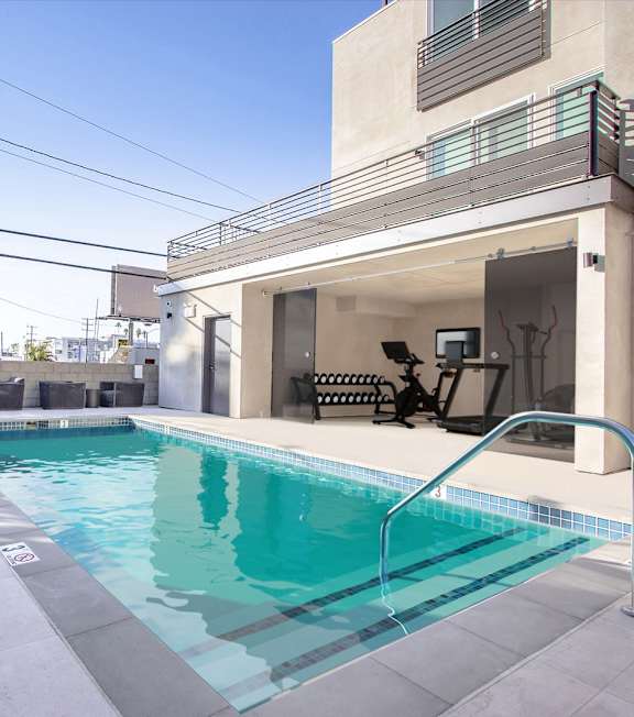 a swimming pool in the backyard of a house