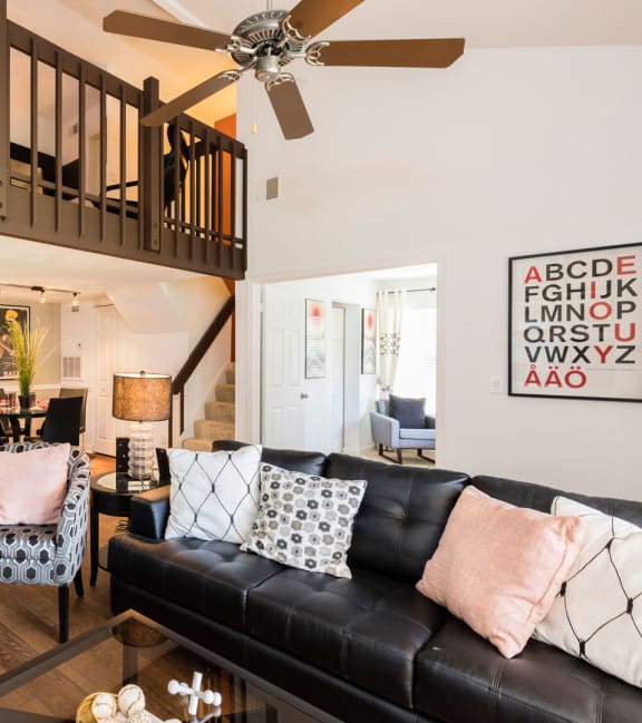 a living room with a couch and a ceiling fan at Whisper Lake Apartments, Winter Park, 32792