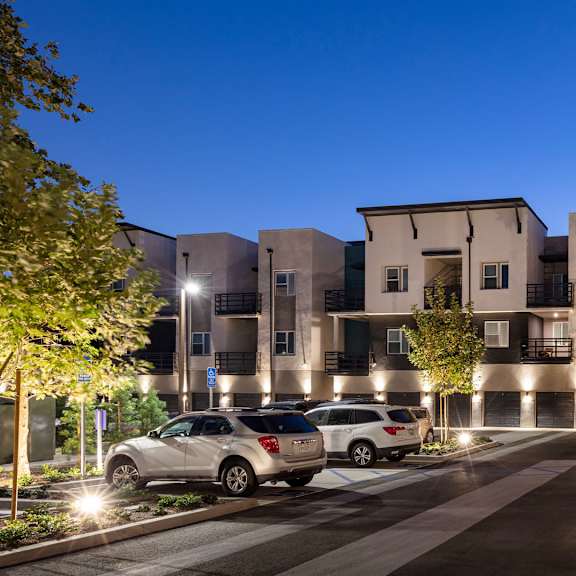 The front of the Mesa Vista Apartments building with a flag flying in the background.