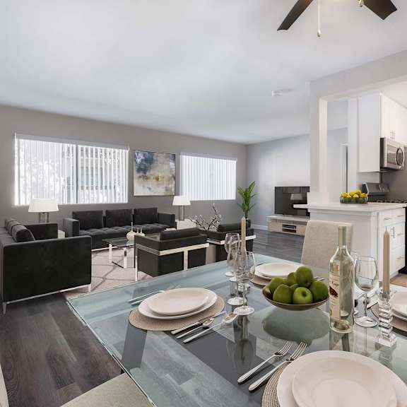 A modern dining room with a glass table set for two.