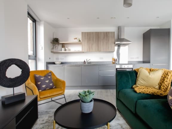 A Modern Living Room with Kitchen Access at Vox Apartments, Manchester, M15 4YD