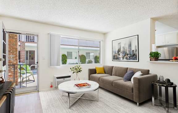 A kitchen with a white table and chairs and a ceiling fan.