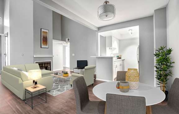 A modern dining room with a round table and chairs.
