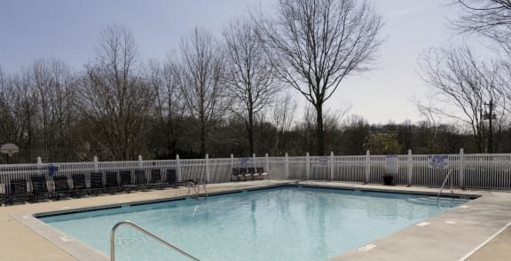 a swimming pool with a fence around it  at Canaan Pointe, Greenville, SC 29607