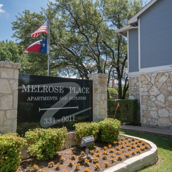 the sign at the entrance to the mediterranean place apartments and gardens