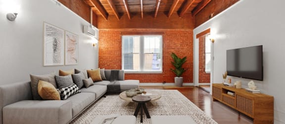 a living room with a couch and a tv