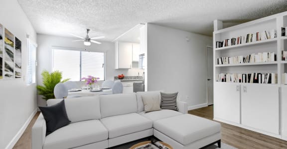 a living room with a white couch and a table