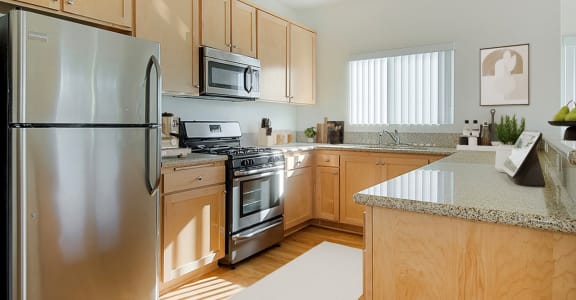 a kitchen with stainless steel appliances and wooden cabinets