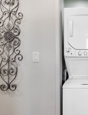a bathroom with a large mirror and a toilet next to a sink
