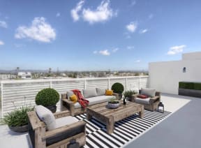 a living room with a couch and a table at The Lucky Apartments, Culver City, CA