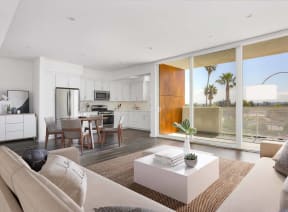 a living room with a couch and a table at The Lucky Apartments, Culver City, CA