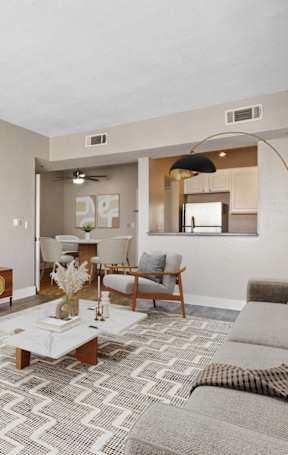 A living room with a fireplace and a television.