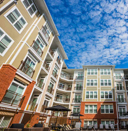 A large apartment complex with a courtyard in the middle.