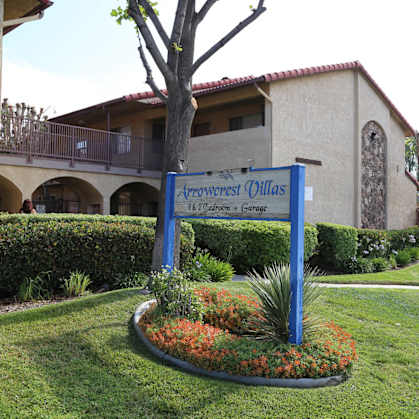 A sign for Arrowcrest Olive reads "1400 S. Orange Ave, Garden Grove.".