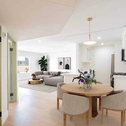 a living room and dining room with a table and chairs