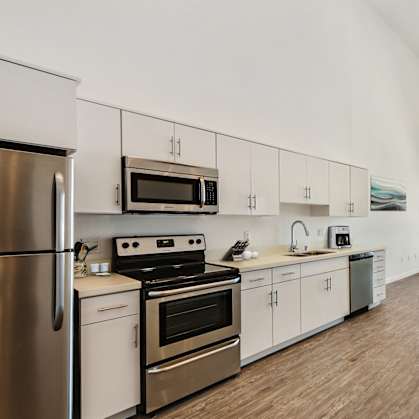 a kitchen and dining area in a 555 waverly unit