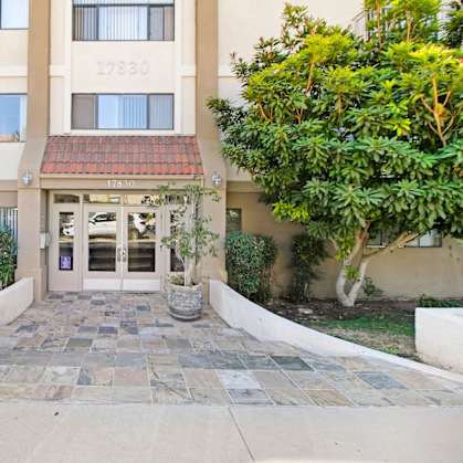 the front entrance to the building of the encinitas condominiums