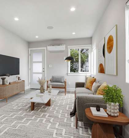 a living room with a couch and a tv