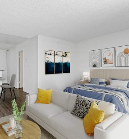 a living room with a couch and a table and a bed