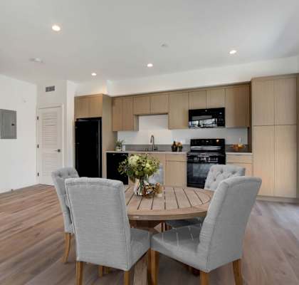 a kitchen and dining area in a 555 waverly unit