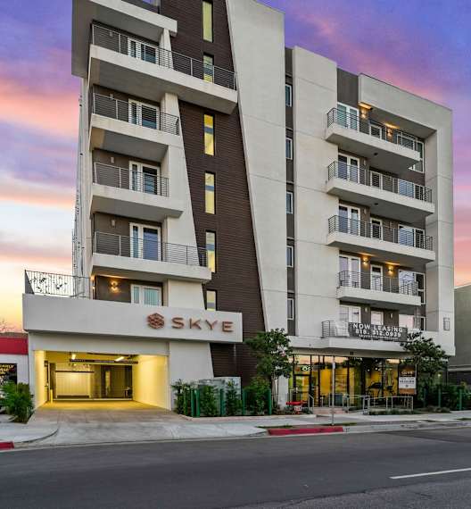 an image of an apartment building on a city street