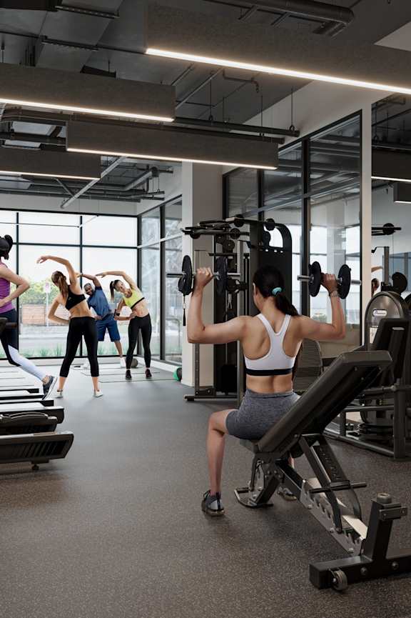 Gym with cardio equipment, weights, treadmills and yoga/workout area at Skylar At Sunset, Los Angeles California