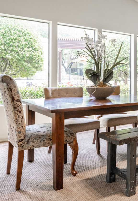 a dining room with a table and chairs and a window at Summit Ridge Apartments, Temple, TX, 76502