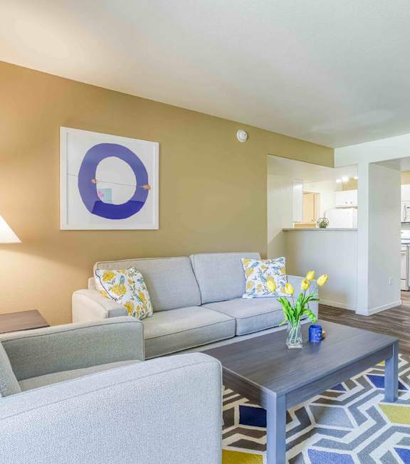 a living room with a spiral staircase and a couch and a table