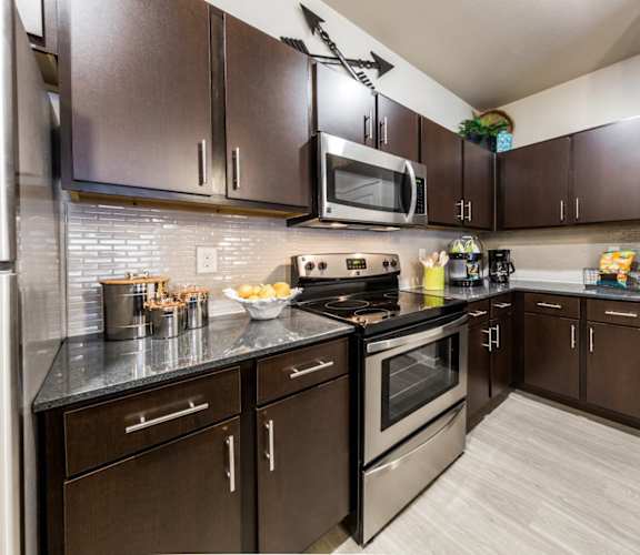 kitchen with stainless steel appliances  at Legacy Creekside Apartments, San Antonio, TX