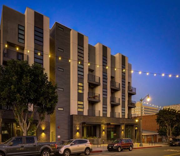 the building where the hotel is located is lit up at night