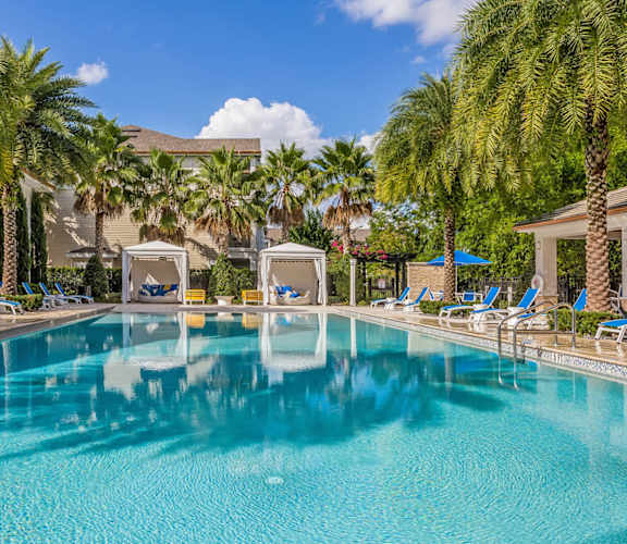 Exterior pool view at Sancerre at Sand Lake with cabanas and lounge chairs