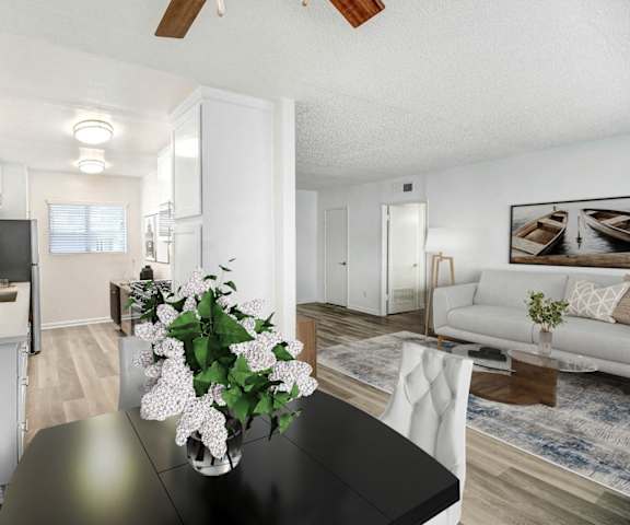 a living room and dining room with a black table
