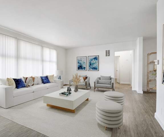 a living room with a white couch and a coffee table