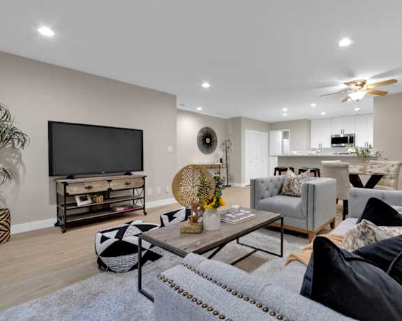 a living room with couches and a coffee table