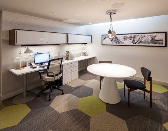 a room with a desk and a computer