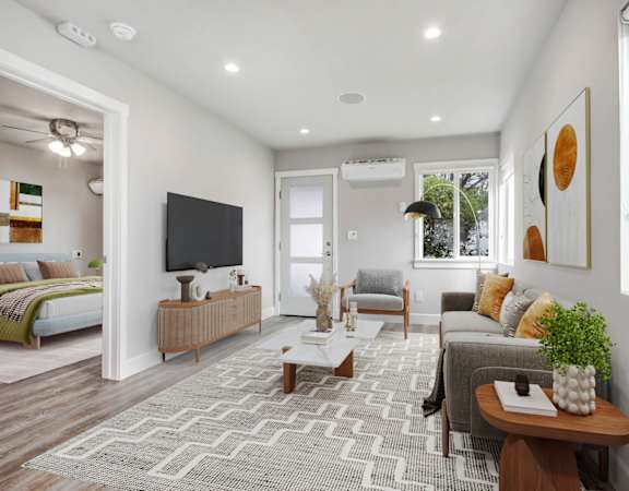 a living room with a couch and a tv