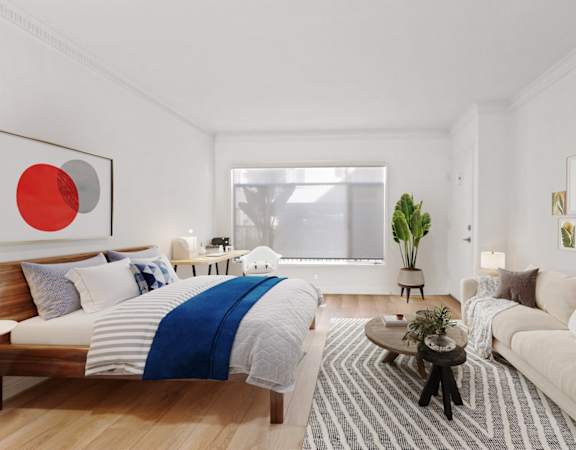a living room with a bed and a couch