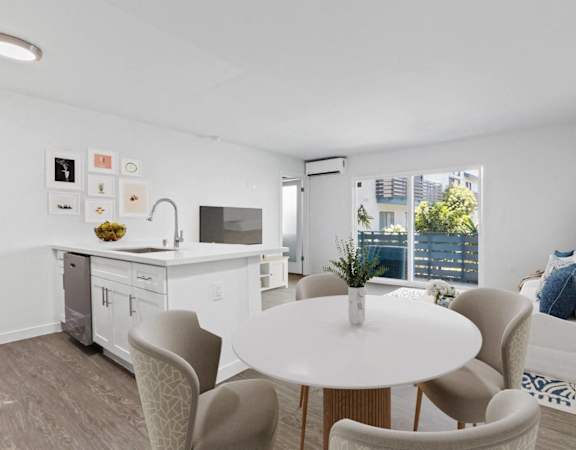 a living room with a white table and chairs