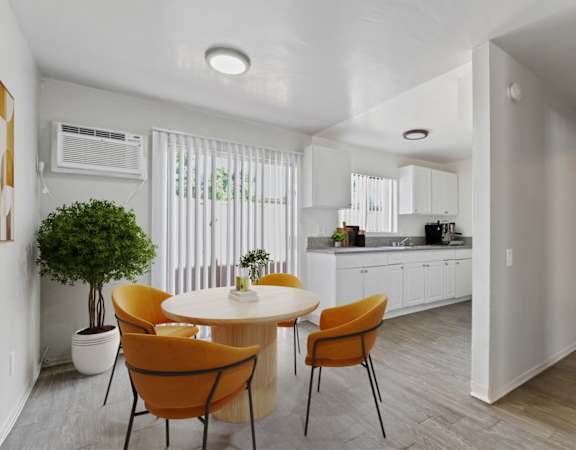 an open kitchen and dining room with a table and chairs
