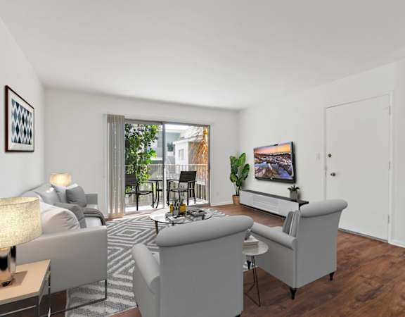 a living room with white walls and a sliding glass door to a patio
