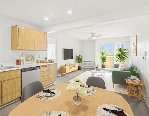 a living room and dining room with a table and chairs