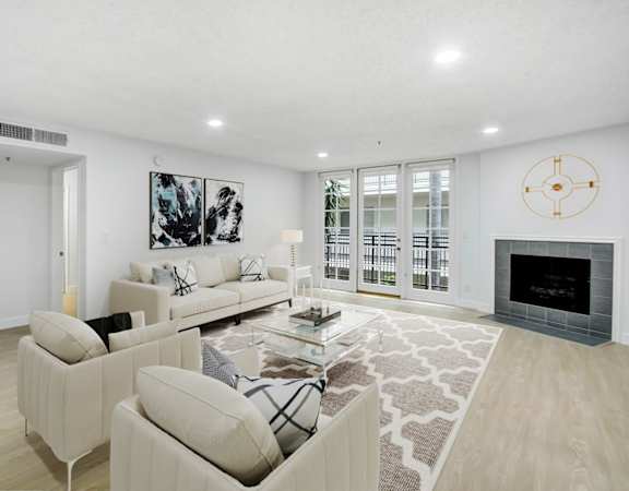 a living room with two couches and a fireplace
