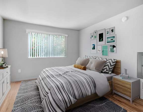 a bedroom with a bed and a rug