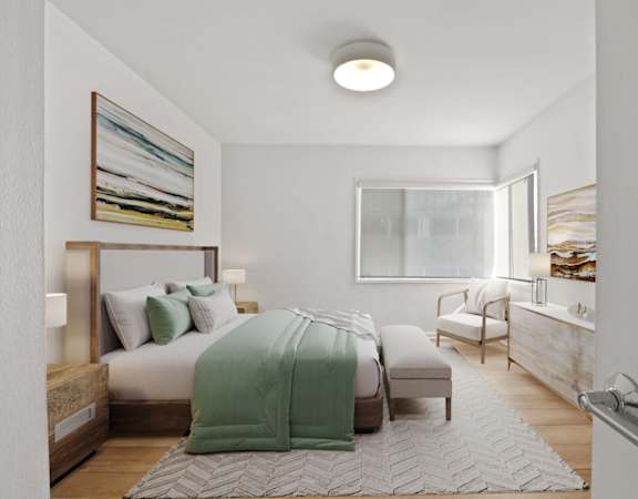 a bedroom with a bed and a desk and a window