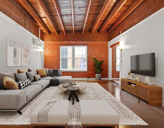 a living room with a couch and a tv